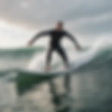 New Surfer Riding a Soft Top Board A beginner practicing on a soft top surfboard