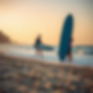 Instructor teaching a surfing lesson on the beach