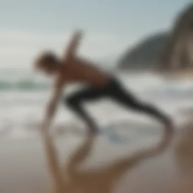 A surfer stretching on the beach to enhance flexibility