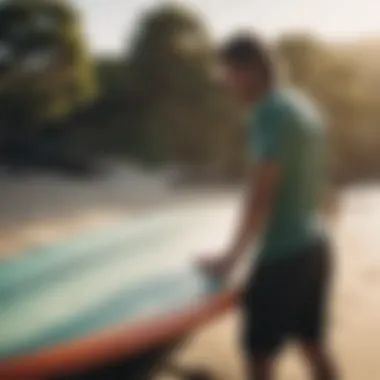 Surfer maintaining and caring for a surfboard.