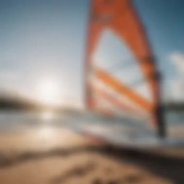 Close-up of essential windsurfing equipment including board and sail