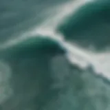 A drone capturing stunning aerial views of surfers riding waves.