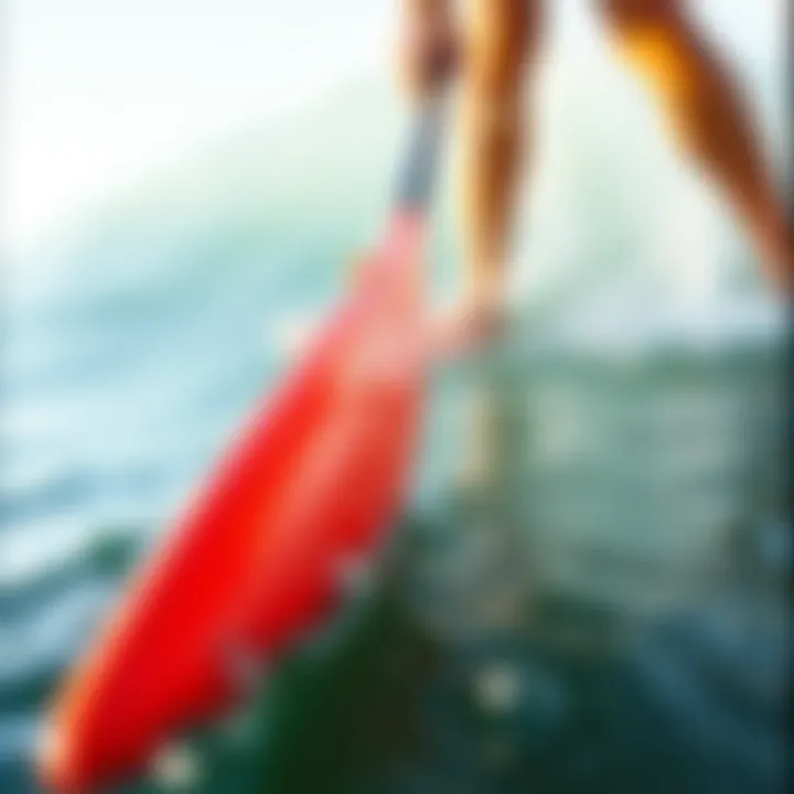 Mastering the Paddling Technique A close-up of a paddle in motion, illustrating the technique of effective paddling.