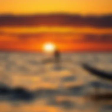 Sunset Serenity on the Water A picturesque sunset over the water, with a paddle boarder enjoying the peaceful scenery.