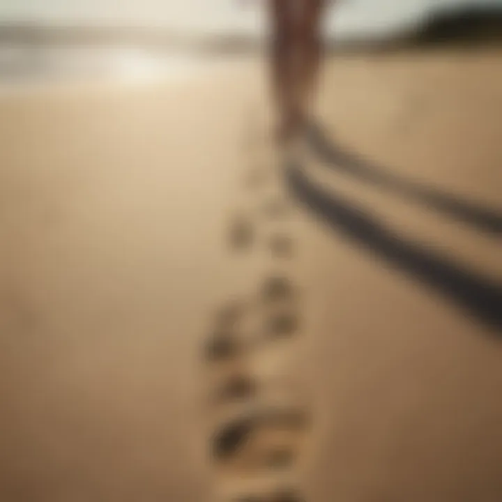 Footprints in the sand leading to the ocean