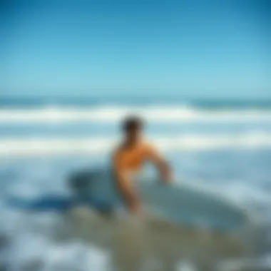 Surfer using a portable rinse kit at the beach