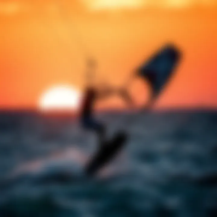 Kitesurfer performing tricks with a foil board against the sunset