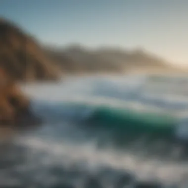 A picturesque view of the coastline with surfers in the distance.