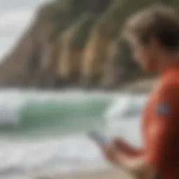 Surfer checking tide information on a smartphone