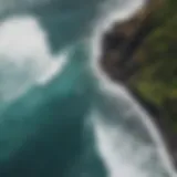 Aerial view of a pristine beach with surfers riding the waves on Big Island.