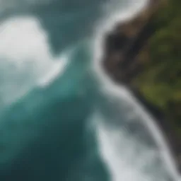 Aerial view of a pristine beach with surfers riding the waves on Big Island.