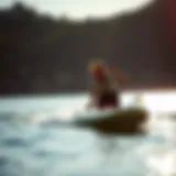 Sleek Motorized Paddleboard in Action A sleek motorized stand-up paddleboard gliding across the water.