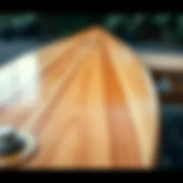 A close-up view of a soft top longboard showcasing its textured surface and design details