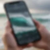 A smartphone displaying a wave forecast app with vibrant ocean waves in the background