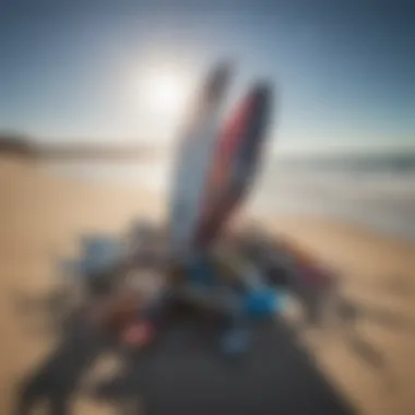 A vibrant assortment of used wing foil gear displayed on a sunny beach.