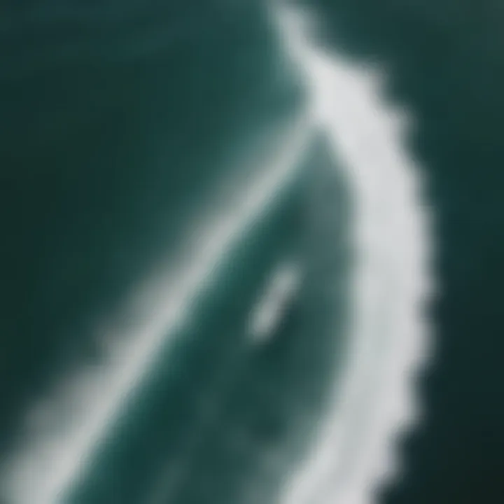 Aerial view of surfers practicing back rolls in the ocean