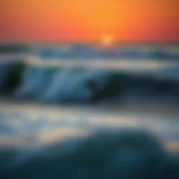 Surfer riding a wave at sunset