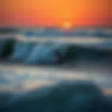 Surfer Riding the Waves at Fernandina Beach Surfer riding a wave at sunset