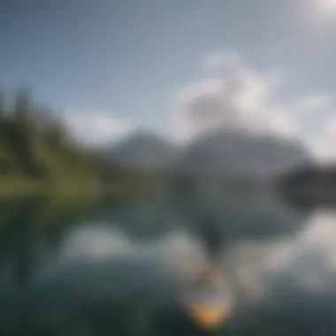 A serene lake with paddle boarders gliding across the surface