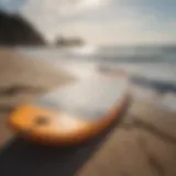 Overview of a soft top foam surfboard on the beach