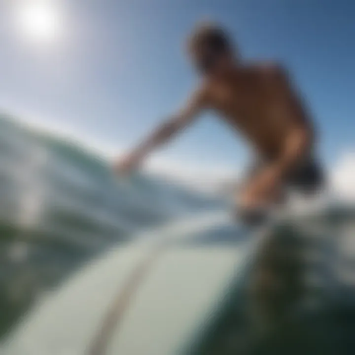 A surfer adjusting a GoPro mount before hitting the waves