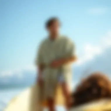 A surfer comfortably changing in a robe poncho