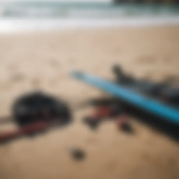 Close-up of kite surfing gear laid out on the beach