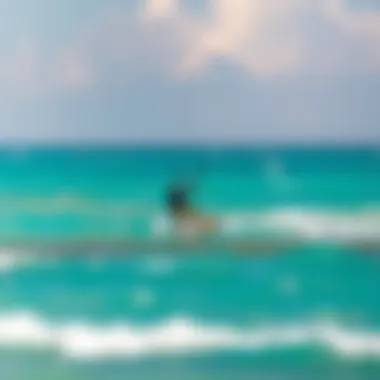 Kiteboarder gliding over turquoise waters