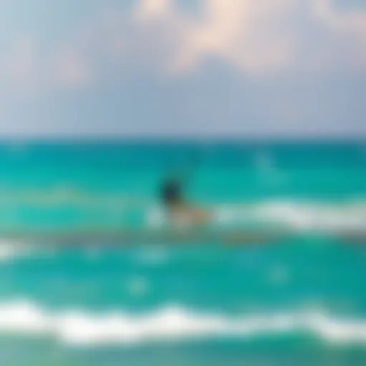 Kiteboarder gliding over turquoise waters