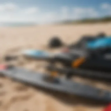 A close-up of kitesurfing equipment laid out on the sand