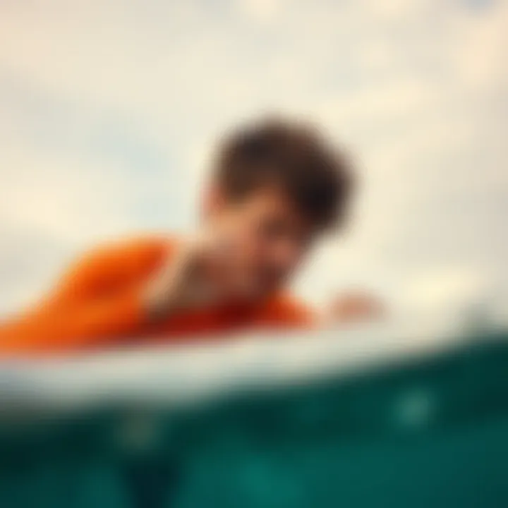 Surfer applying maintenance to a surfboard nose protector