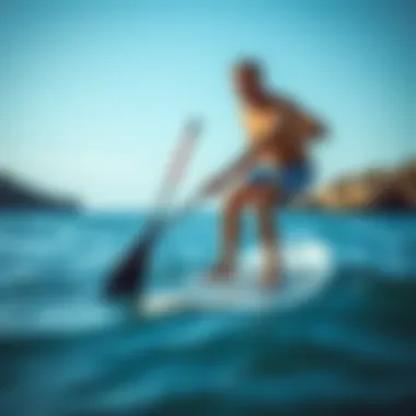 Proper Grip and Stance for SUP Paddling Demonstration of proper paddle grip and stance on a stand-up paddleboard