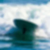 The Dynamics of Motorized Surfboards A sleek motorized surfboard cutting through waves