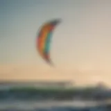 A stylized kite soaring over the ocean waves