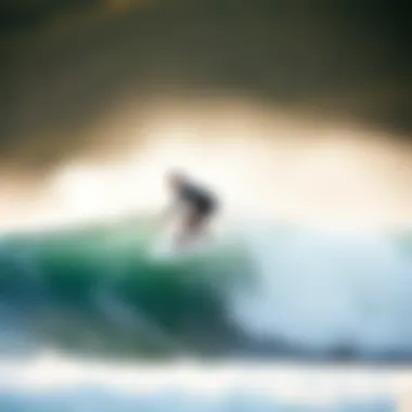 Surfer riding a wave with the Naish Triad surfboard