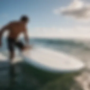 A surfer maintaining the Ocean Rodeo Mako surfboard, emphasizing essential upkeep practices.