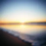 Tranquil Beach Sunset A tranquil beach at sunset with gentle waves lapping the shore