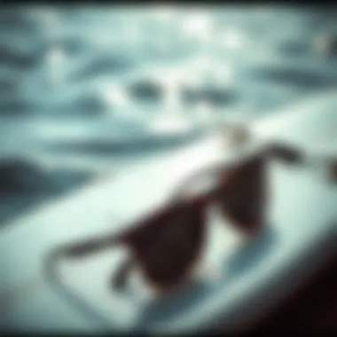 Fashion Meets Functionality in Water Sports A pair of stylish sunglasses resting on a surfboard