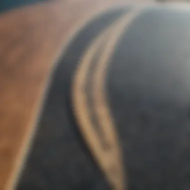 Close-up of surfboard griptape with peeling edges