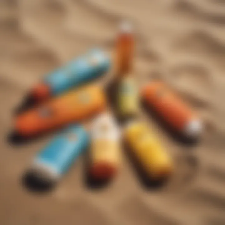 Close-up of various sunblock products on a sandy surface