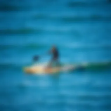 A paddle boarder demonstrating stability on calm waters