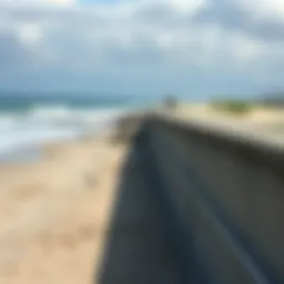 A robust concrete seawall protecting a beach from erosion
