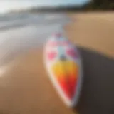 A vibrant soft top surfboard on the beach