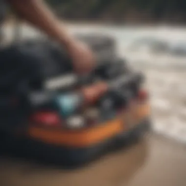 A surfer packing a travel bag with various surf equipment.