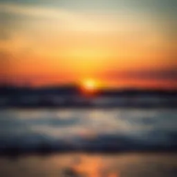 A breathtaking view of the sunrise over the ocean with waves gently lapping at the shore