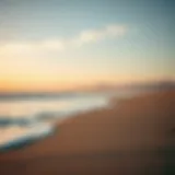 A serene beach landscape with gentle waves and soft sand under a sunset sky