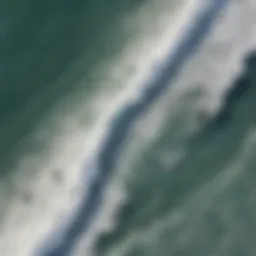 Aerial view of surfers catching waves with wind patterns indicated