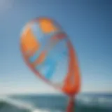 Close-up of a vibrant wind sock fluttering against a clear blue sky