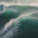 Aerial view of surfers riding waves influenced by wind gusts