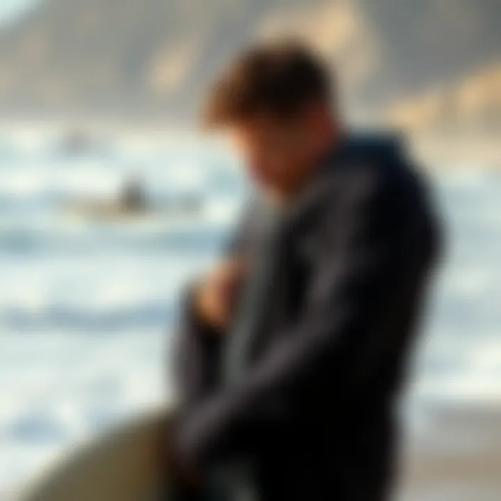 Practical Application of Wetsuit Changing Robe An individual using a wetsuit changing robe at the beach, highlighting its functionality in a surf setting.